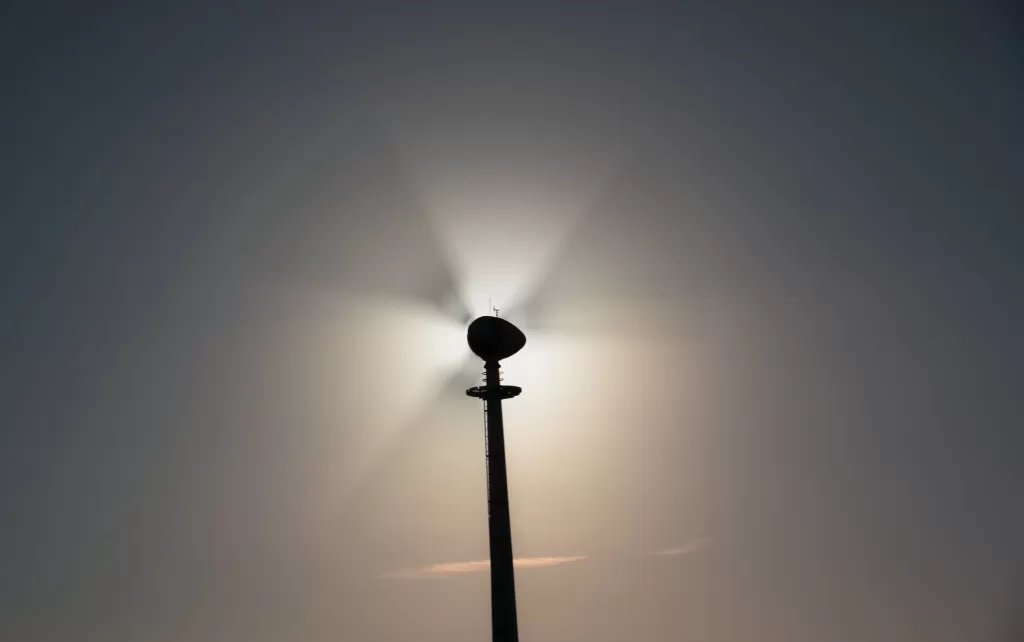 Wind Turbine and the sun directly behind it